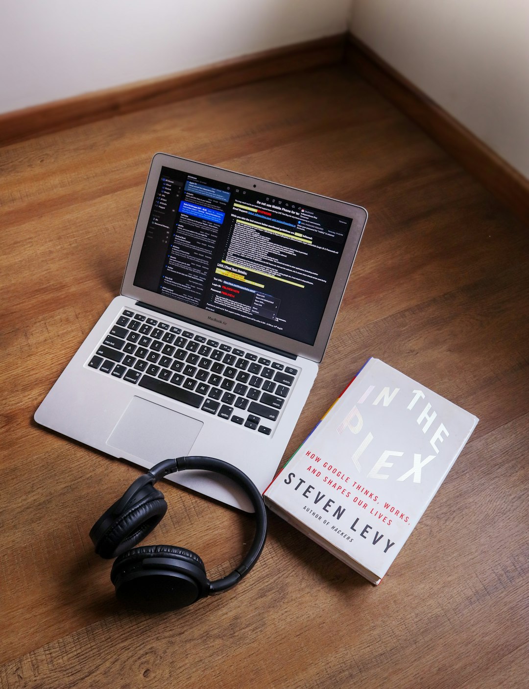 A stock image of laptop, music and books