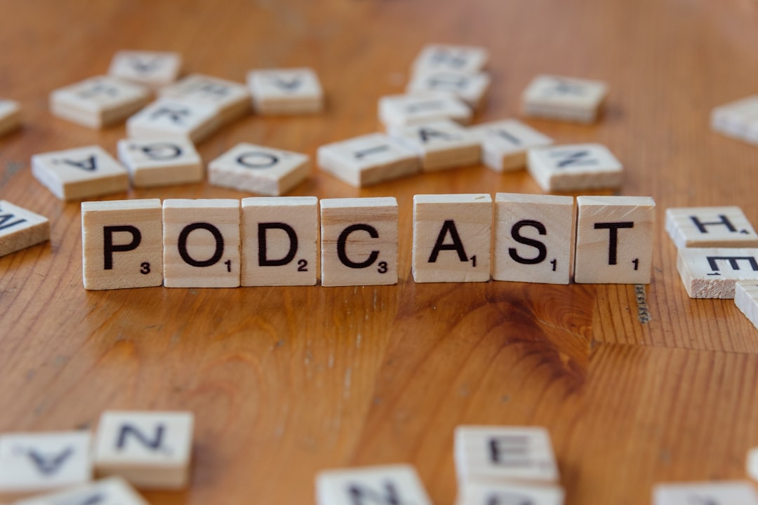 a-wooden-table-topped-with-scrabble-tiles-that-spell-out-the-word-podcast-h8v7dos7fnm